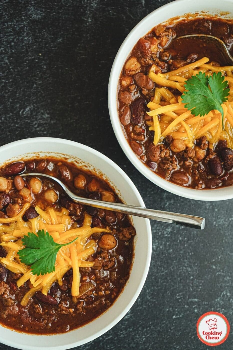 A hearty and mild 3 bean chili served in a bowl, garnished with fresh herbs.