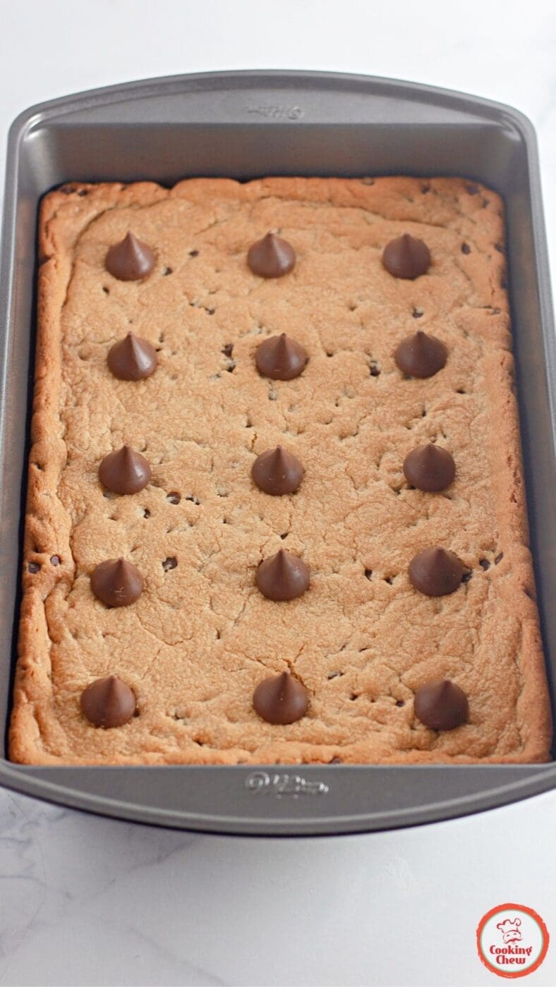 A batch of golden peanut butter cookie bars, cut into squares and ready to serve.