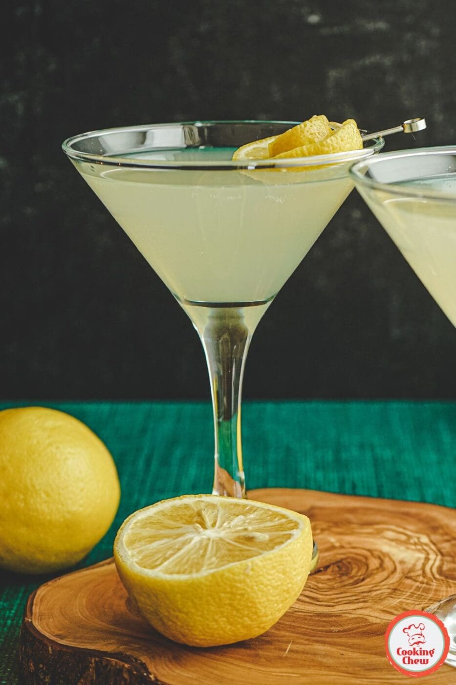 A vibrant lemon vodka cocktail garnished with a slice of lemon and served in a sleek glass.
