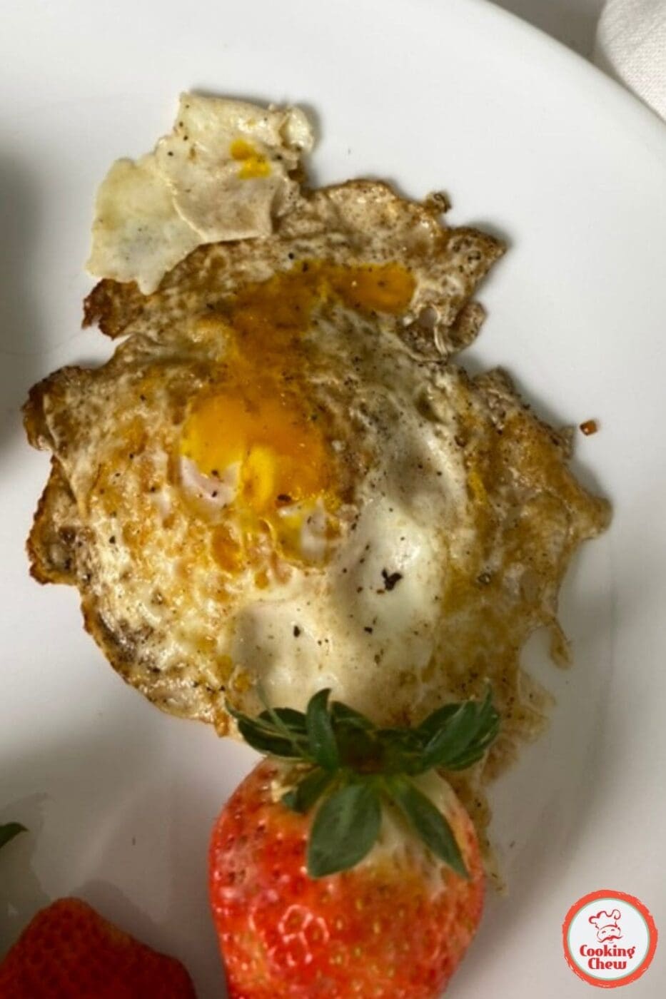A perfectly cooked fried egg in a cast iron skillet, showing a smooth, non-stick surface.