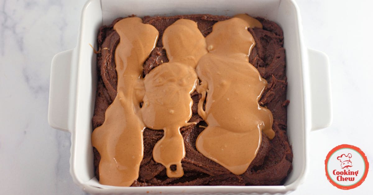A plate of fudgy peanut butter swirl brownies with a fork.