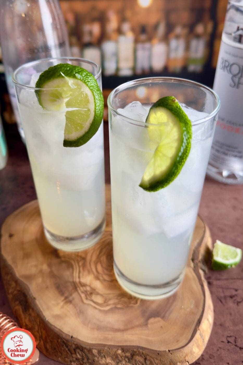 A chilled Lime Vodka Cooler served over ice, garnished with fresh lime slices and mint.