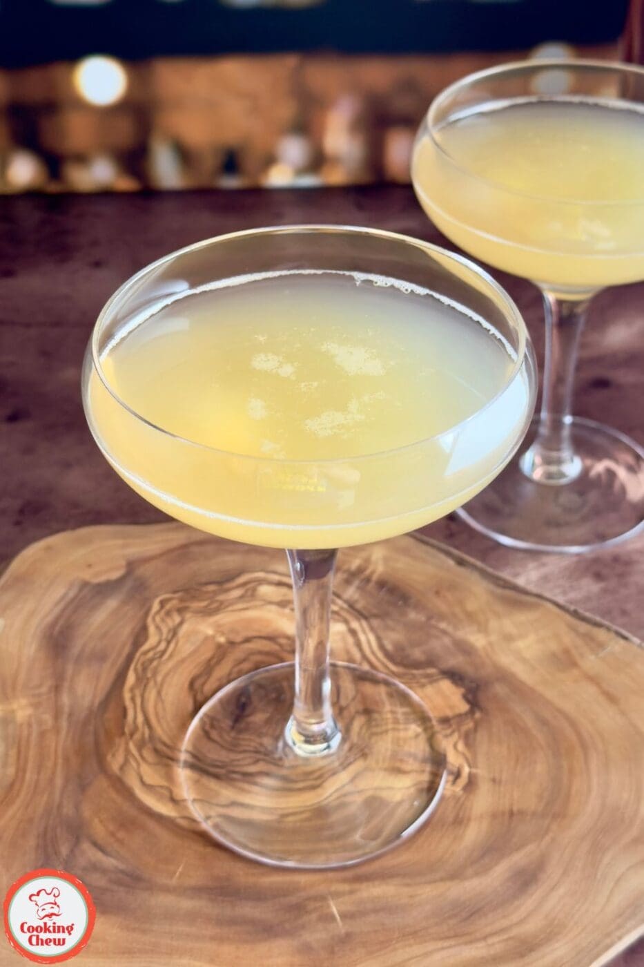 A classic Lime Whiskey Sour served over ice, garnished with a fresh lime wheel.