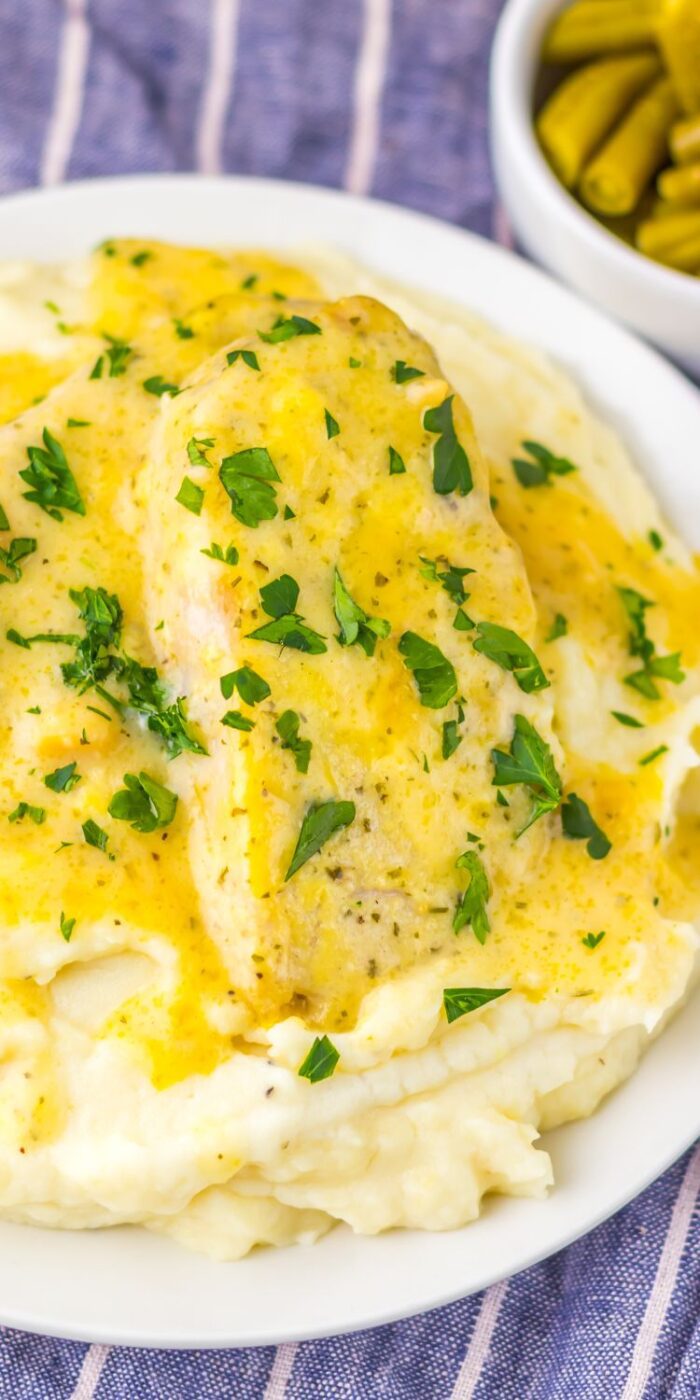 Tender ranch pork chops smothered in creamy sauce, served from a slow cooker for an easy weeknight dinner