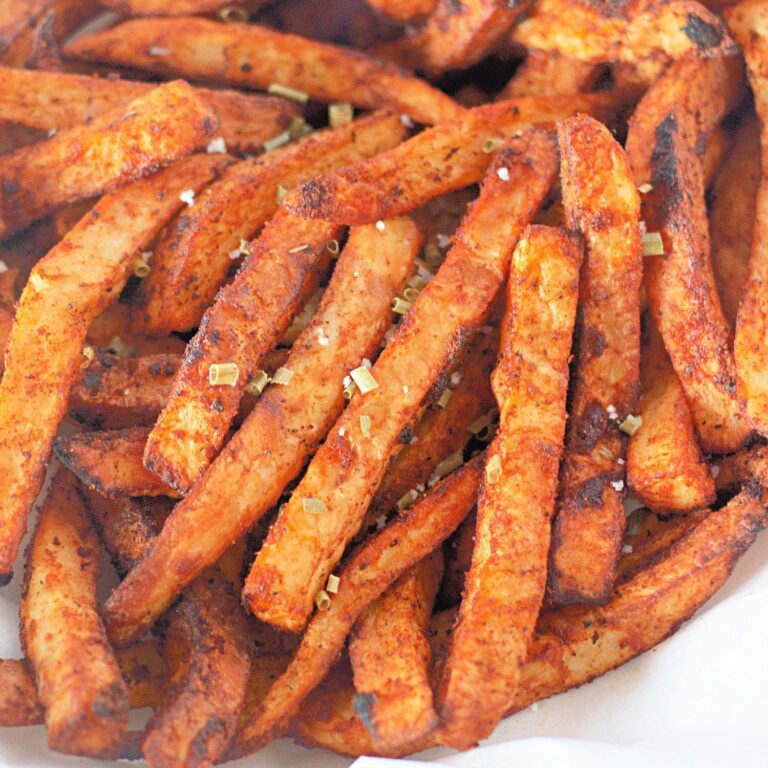 Golden air fryer fries seasoned to perfection.​