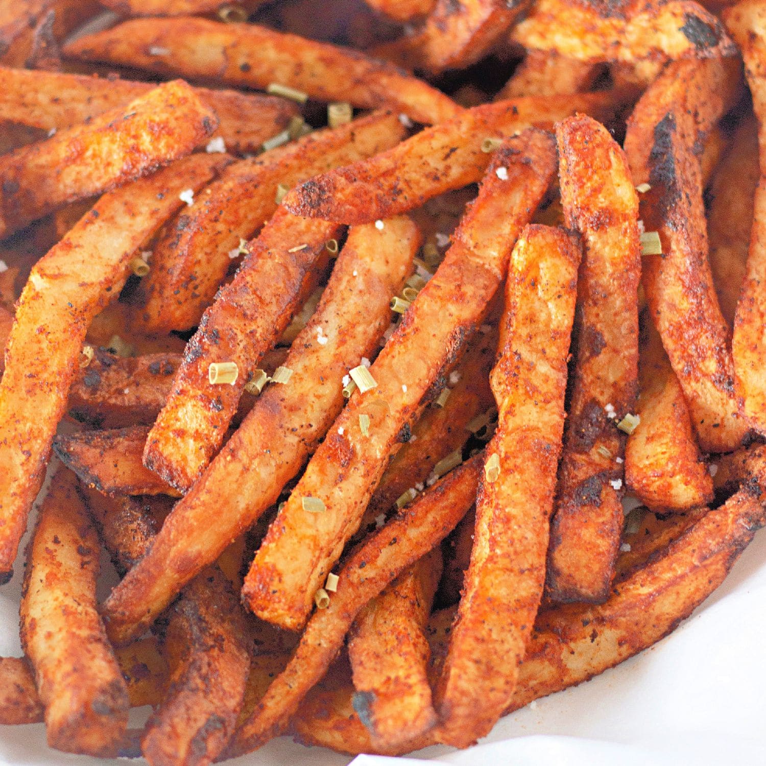 Golden air fryer fries seasoned to perfection.​