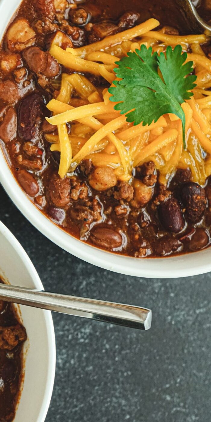 Mild 3 bean chili in a bowl, a hearty vegetarian recipe made in a slow cooker, perfect for a healthy meal.