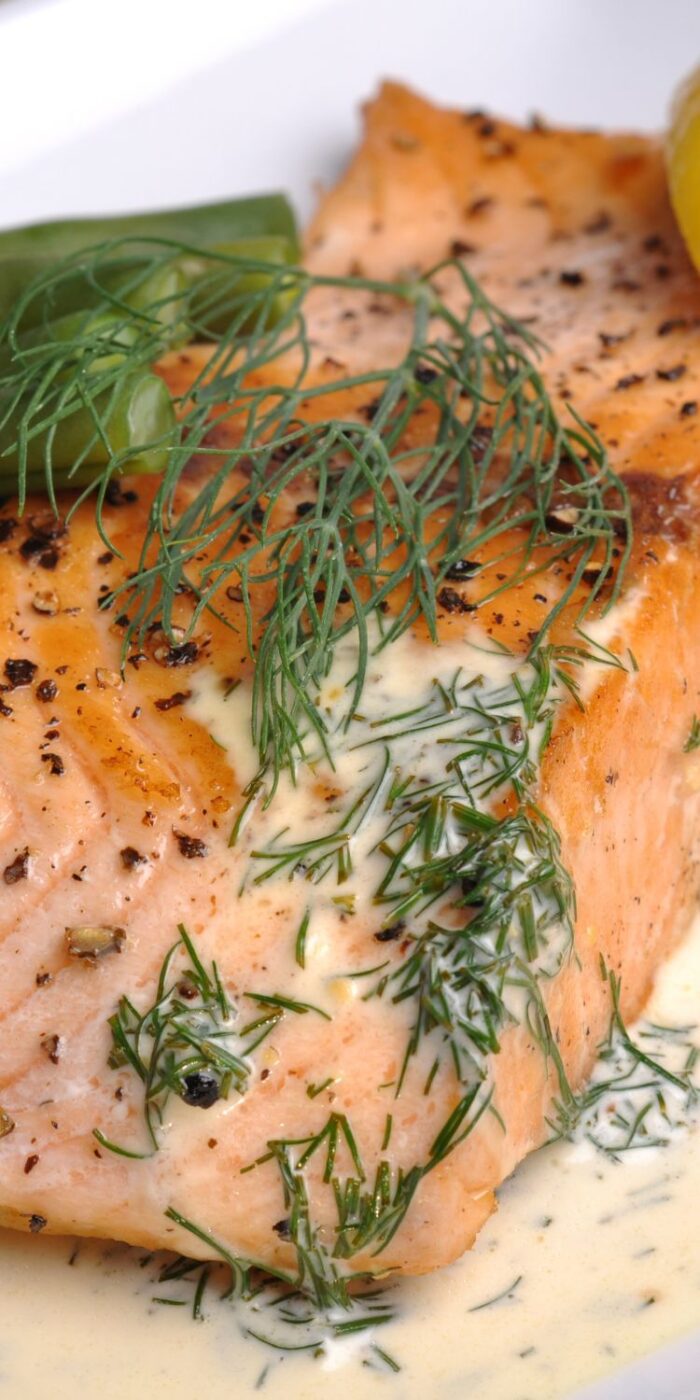 Lemon and dill salmon served with a fresh herbed salad, a healthy and easy meal perfect for a light dinner.