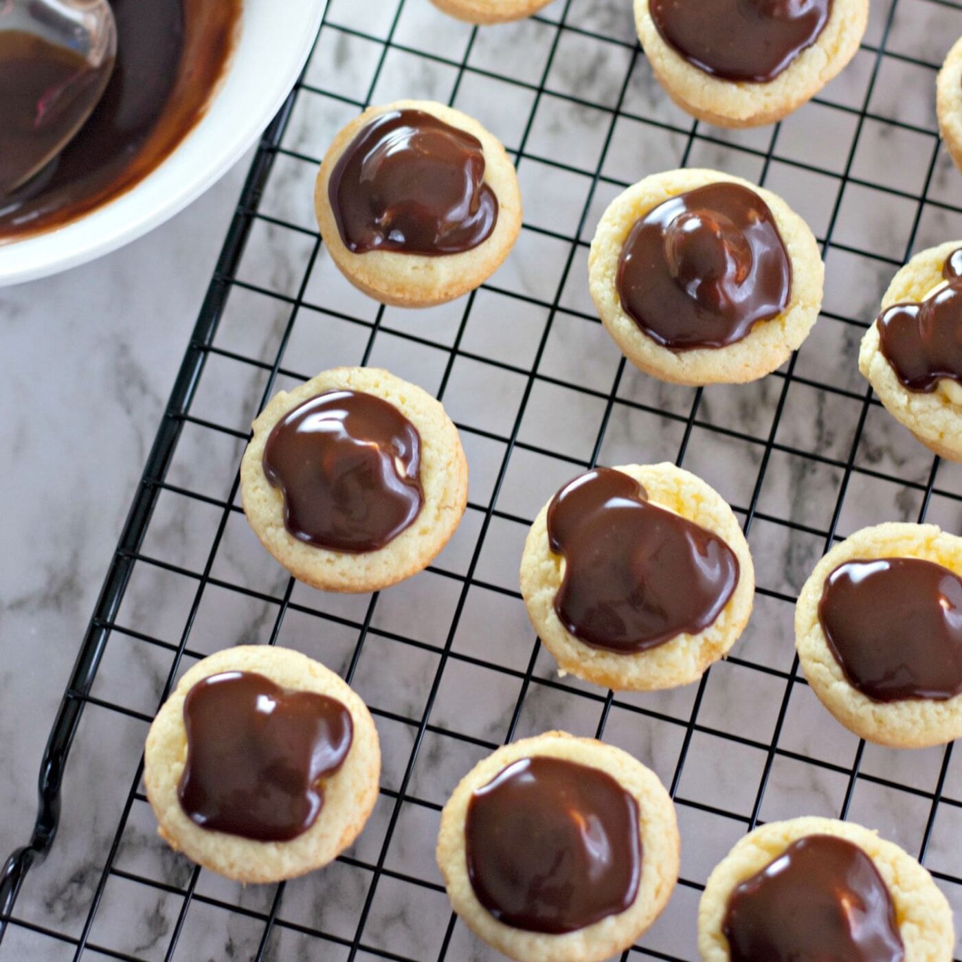 Mini Boston Cream Pie cookie bites topped with chocolate