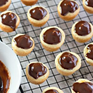 Cream-filled sugar cookie cups with ganache topping