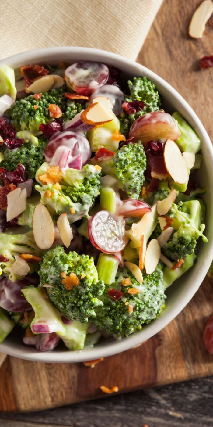 A creamy, crunchy broccoli salad made with fresh broccoli, mayo, and topped with bacon and sunflower seeds.