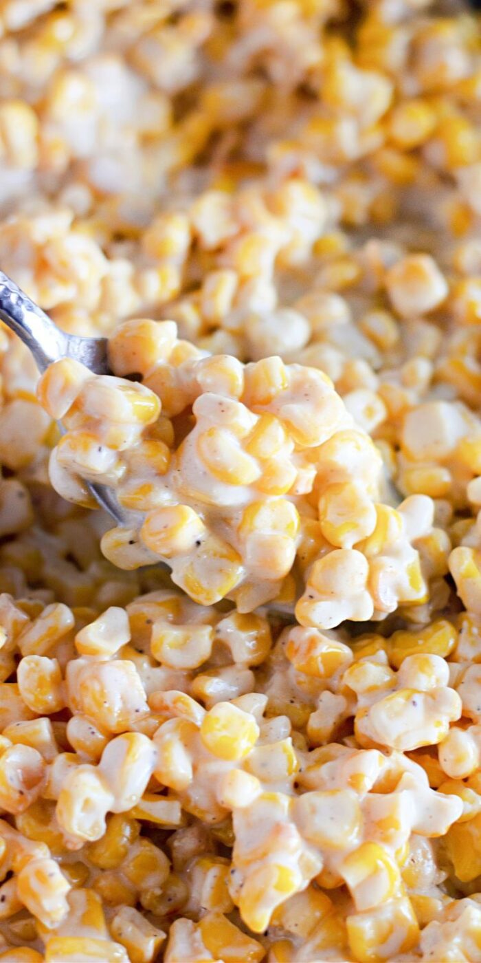 A bowl of creamy, homemade creamed corn made in a skillet, with a rich texture and buttery flavor, ready to be served as a side dish.
