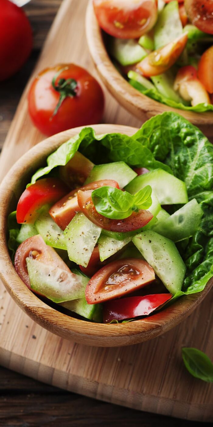 A fresh cucumber tomato salad made with basil and dill&mdash;perfect light side dish for summer.