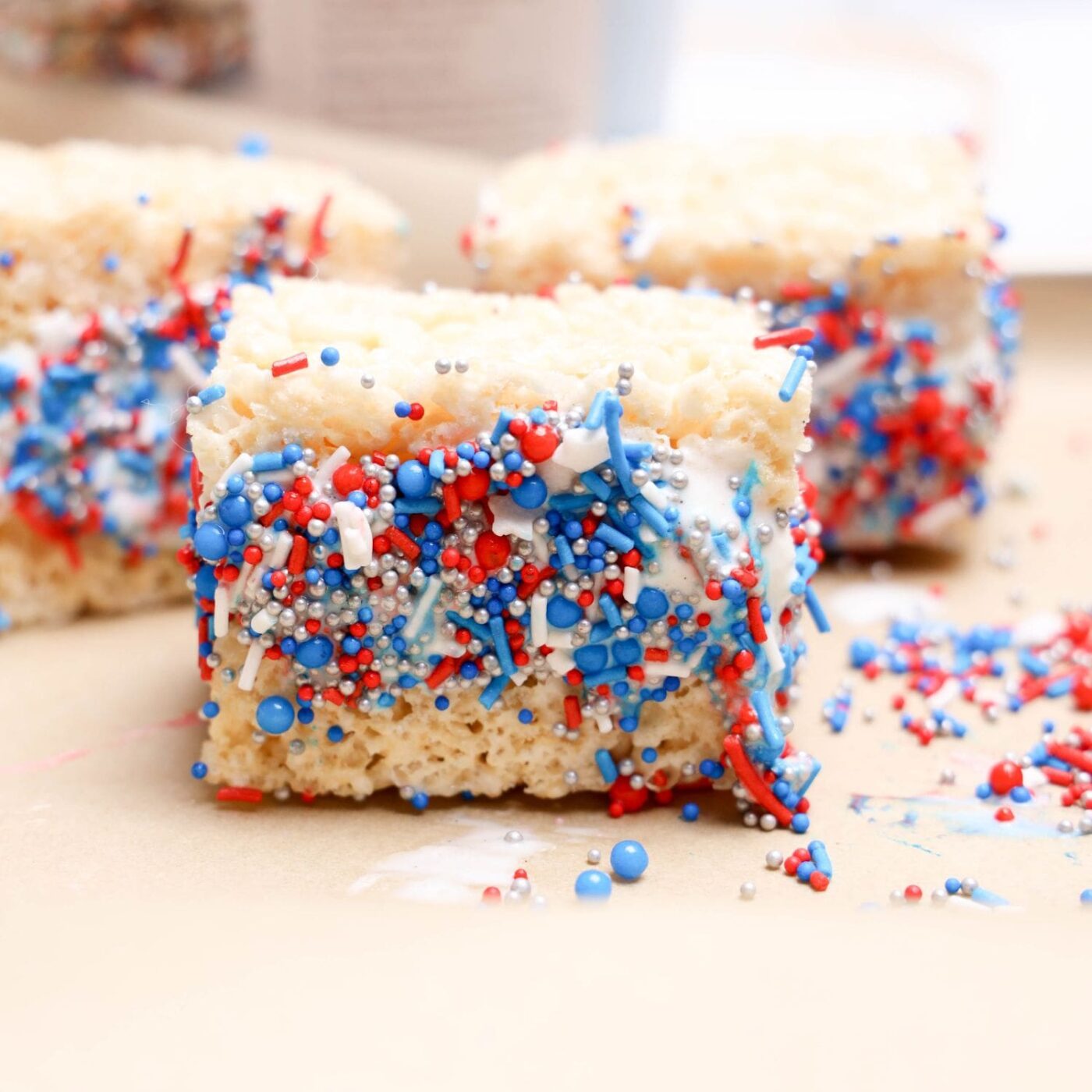 A festive display of red, white, and blue Rice Krispies ice cream sandwiches.