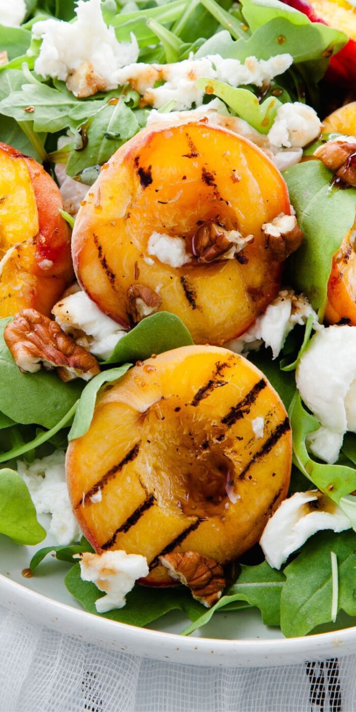 Elegant grilled peach salad recipe with champagne vinaigrette.