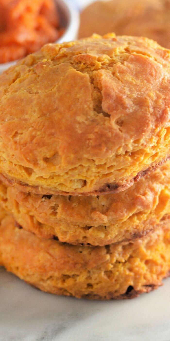 Recipe for warm and flaky pumpkin biscuits perfect for fall.