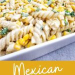 A close-up of elote pasta salad, highlighting the creamy dressing and charred corn.