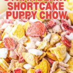 A bowl of pink strawberry shortcake puppy chow with white chocolate coating.