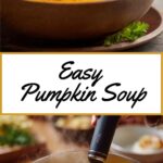 Creamy pumpkin soup in a dark bowl, topped with fresh parsley and a swirl of cream