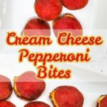 Crispy baked pepperoni bites with cream cheese filling on a white platter.