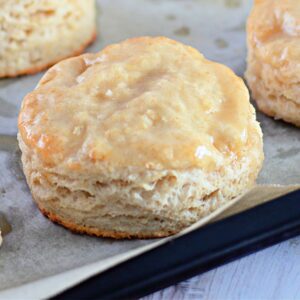Recipe card featuring flaky honey butter biscuits brushed with glaze.