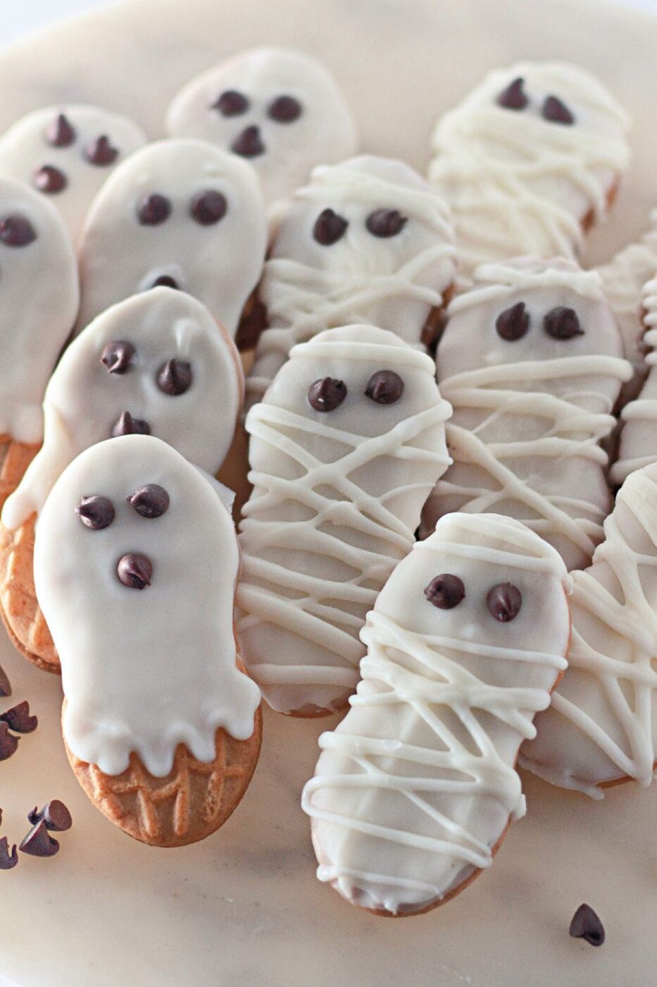 No-bake Halloween cookies with chocolate chip eyes cooling on a wire rack.