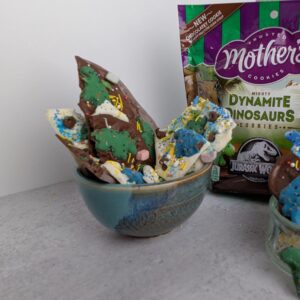 Easy recipe card image of dino-themed chocolate bark with marshmallows and sprinkles.