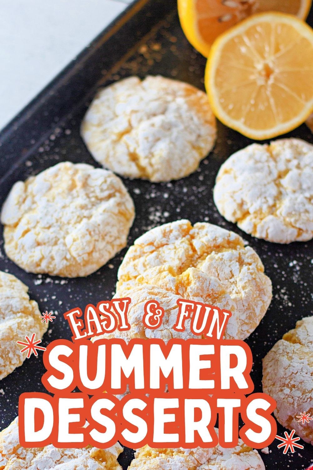 Lemon cookies dusted with powdered sugar on a summer-themed plate.
